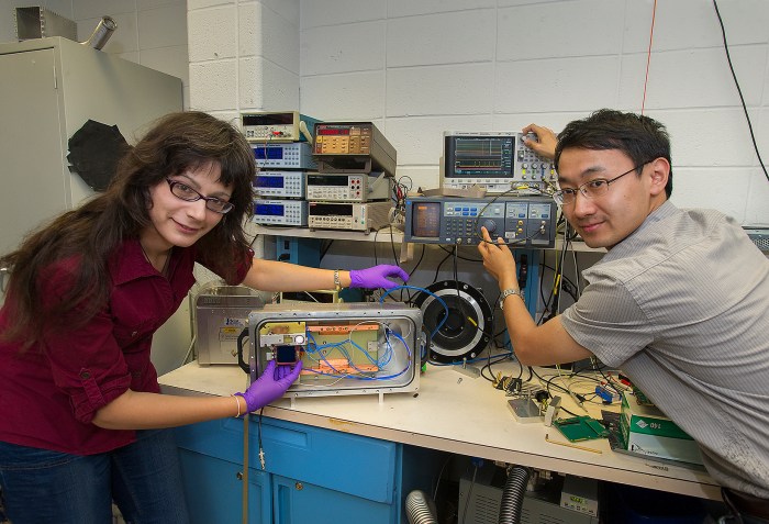 Design Engineer Justine Haupt (left) and Postdoctoral Research Associate Dajun Huang (right) prepare a test chamber that scientists in the Instrumentation Division are are using to evaluate the digital sensors they are designing for the Large Synoptic Survey Telescope, which is scheduled to see "first light" in 2020, and start surveying in 2022.
